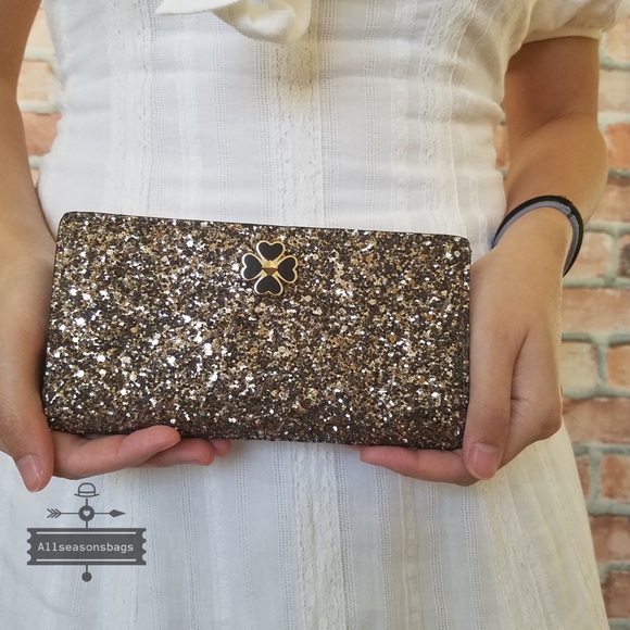 kate spade Handbags - Kate spade large slim bifold wallet glitter
